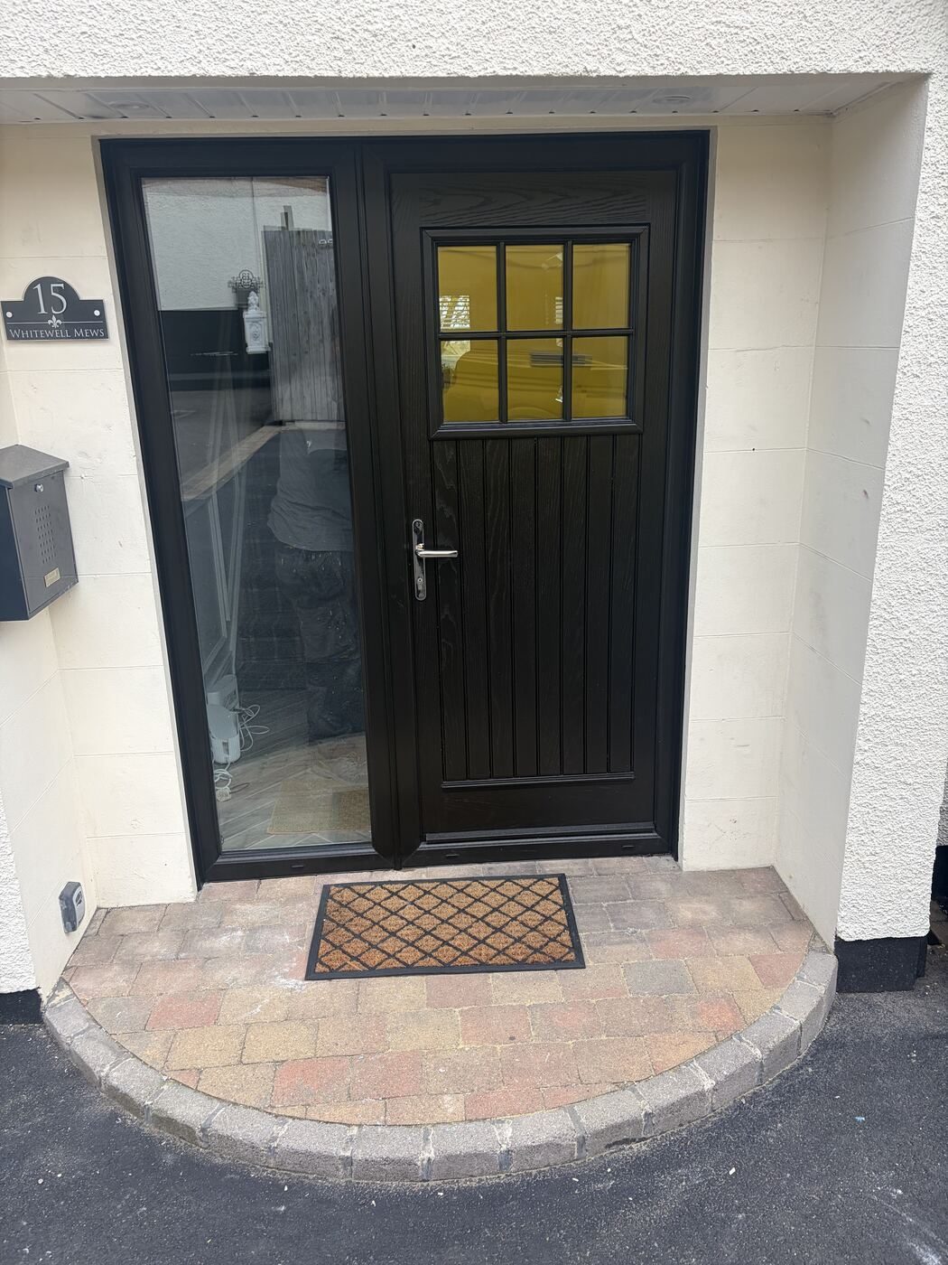 Black composite stable-style front door with glazed sidelight, fitted in Belfast